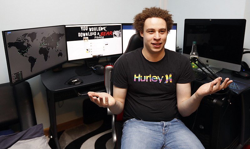 
              FILE - In this Monday, May 15, 2017, file photo, British IT expert Marcus Hutchins speaks during an interview in Ilfracombe, England. Hutchins, a young British researcher credited with derailing a global cyberattack in May, has been arrested for allegedly creating and distributing banking malware, U.S. authorities say. Hutchins was detained in Las Vegas on Wednesday, Aug. 2, 2017, while flying back to Britain from Defcon, an annual gathering of hackers of IT security gurus. A grand jury indictment charges Hutchins with “creating and distributing” malware known as the Kronos banking Trojan. (AP Photo/Frank Augstein, File)
            