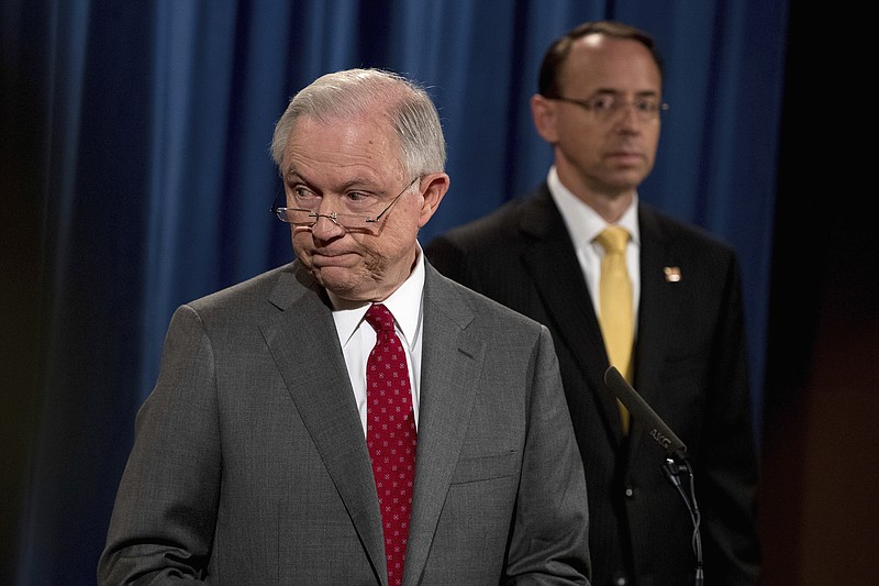 
              Deputy Attorney General Rod Rosenstein watches at right as Attorney General Jeff Sessions steps away from the podium during a news conference at the Justice Department in Washington, Friday, Aug. 4, 2017, on leaks of classified material threatening national security. (AP Andrew Harnik)
            