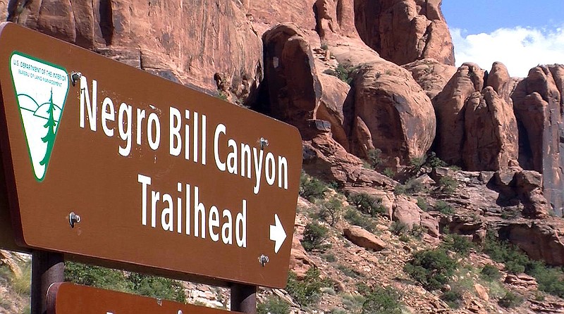 
              FILE - This undated file photo shows a sign at the entrance of the Negro Bill Canyon Trailhead in Moab, Utah. A Utah state commission is recommending preserving the name of Utah's Negro Bill Canyon despite concerns that it's offensive. (John Hollenhorst/The Deseret News via AP, File)
            