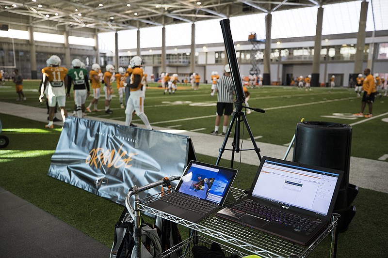 Computer monitors display information from the Catapult GPS tracking system on the sideline during Tennesee's practice Friday in Knoxville.