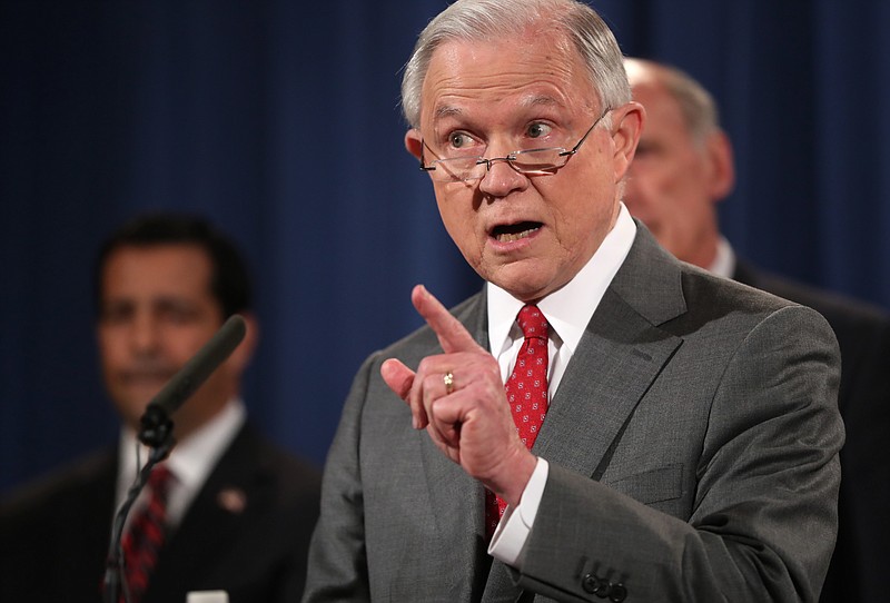 
              Attorney General Jeff Sessions, accompanied by, from left, National Counterintelligence and Security Center Director William Evanina, Director of National Intelligence Dan Coats, speaks during a news conference at the Justice Department in Washington, Friday, Aug. 4, 2017, on leaks of classified material threatening national security.  (AP Andrew Harnik)
            