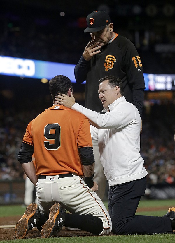 Brandon Belt placed on 7-day concussion DL, Pablo Sandoval called