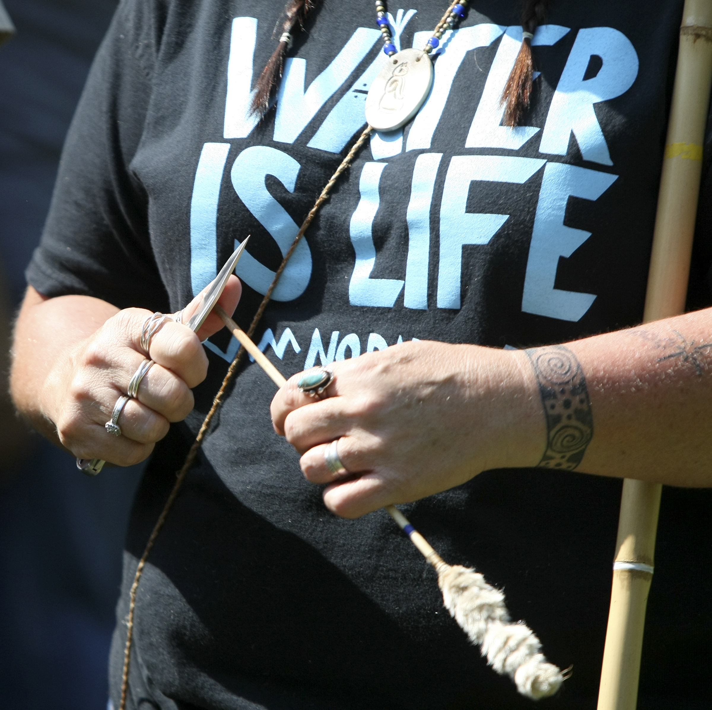 Sharlene Brooks sharpens a dart before the blowgun tournament begins during the 2017 Cherokee Cultural Celebration at Red Clay State Historic Park on Sunday, Aug. 6, in Cleveland, Tenn.