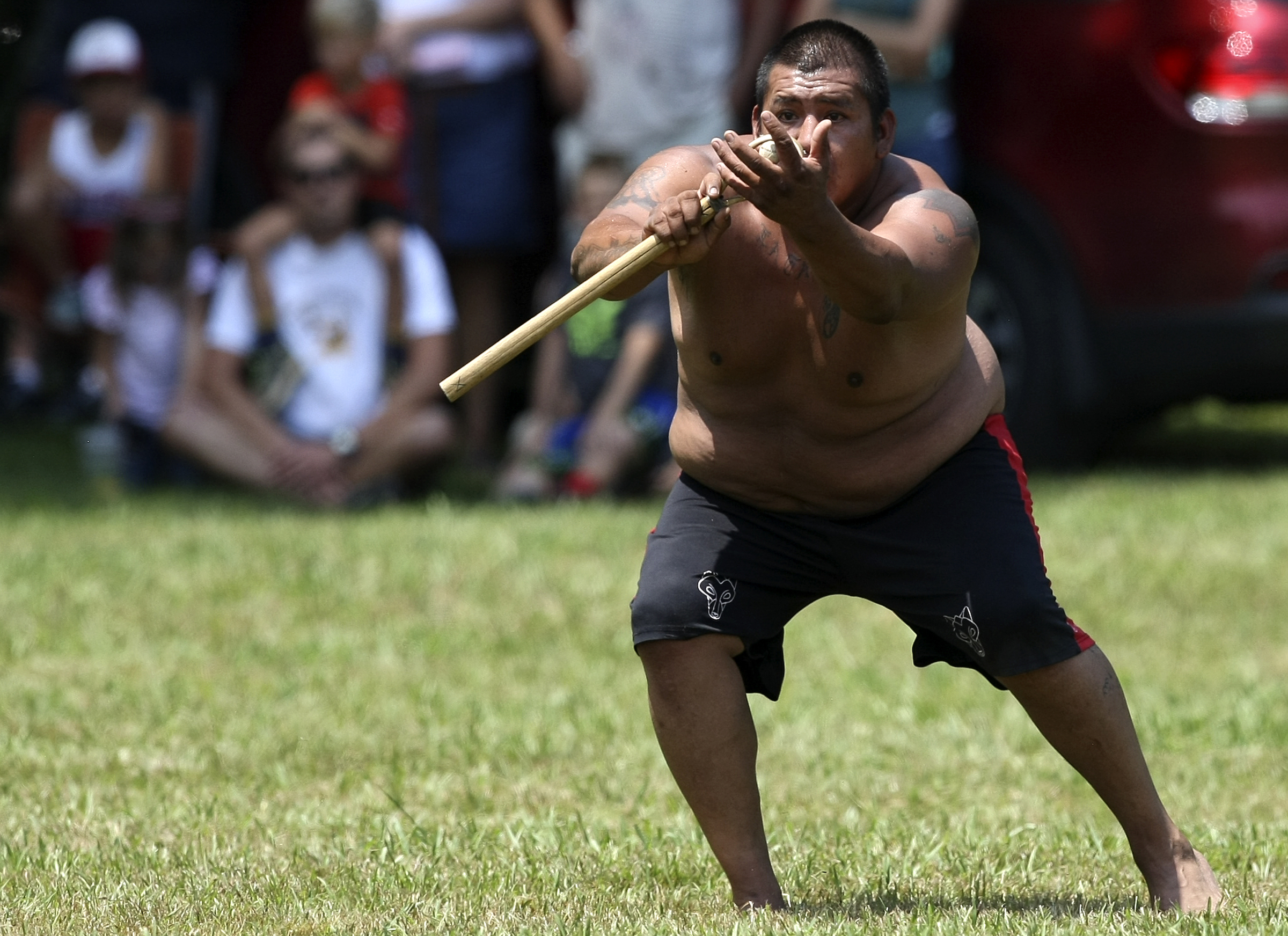 Junebug Taylor fields the ball during a stickball game demonstration by the Wolftown team during the 2017 Cherokee Cultural Celebration at Red Clay State Historic Park on Sunday, Aug. 6, in Cleveland, Tenn. Stickball is a traditional, full-contact Native American sport similar to lacrosse.