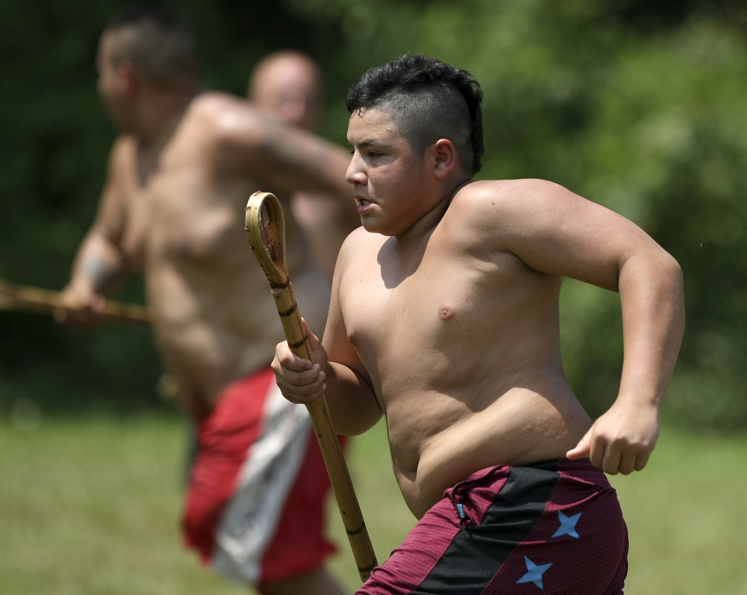 Carson Taylor runs on his way to score during a stickball game demonstration by the Wolftown team during the 2017 Cherokee Cultural Celebration at Red Clay State Historic Park on Sunday, Aug. 6, in Cleveland, Tenn. Stickball is a traditional, full-contact Native American sport similar to lacrosse.