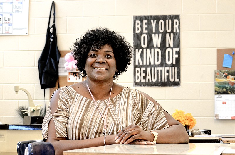 Natalie Cothran, a science teacher at East Lake Academy, is a two-time recipient of a kidney transplant.Staff Photo by Robin RuddNatalie Cothran, a science teacher at East Lake Academy, is a two-time recipient of an organ transplant. Ms. Cothran was photographed in her classroom on Friday.