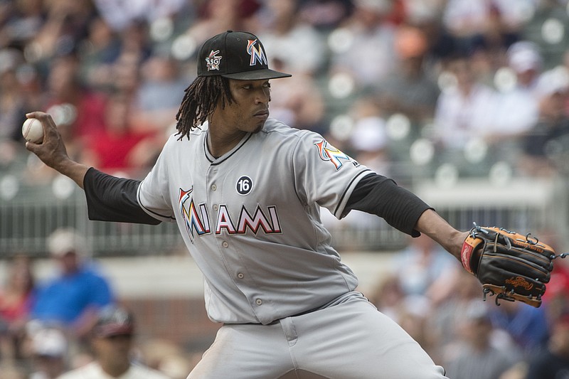 Miami Marlins' Jose Urena, of Dominican Republic, pitches against the Atlanta Braves during the first inning of a baseball game, Sunday, Aug. 6, 2017, in Atlanta. (AP Photo/John Amis)