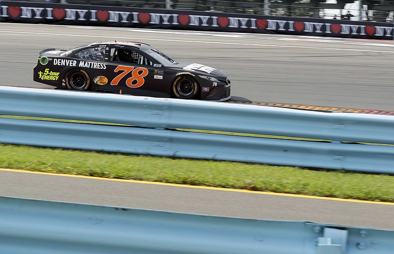 Martin Truex Jr. drives during the NASCAR Cup Series auto race, Sunday, Aug. 6, 2017, in Watkins Glen, N.Y.