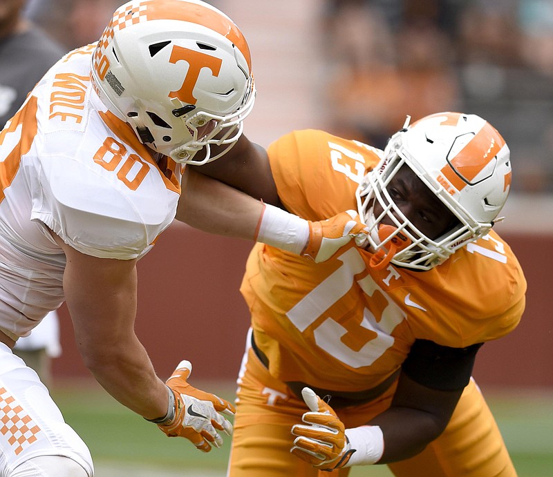 Eli Wolf (80) and Deandre Johnson (13) compete in the one-on-one segment of the game.  The annual Spring Orange and White Football game was held at Neyland Stadium on April 22, 2017.