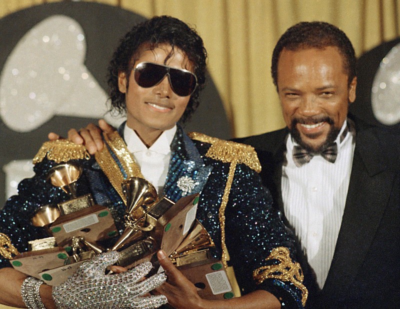 
              FILE - In this Feb. 28, 1984, file photo, Michael Jackson, left, holds eight awards as he poses with Quincy Jones at the Grammy Awards in Los Angeles. Jackson's estate announced Aug. 7, 2017, that a 3-D version of his iconic "Thriller" video will debut at the Venice Film Festival, which begins Aug. 30.
 (AP Photo/Doug Pizac, File)
            