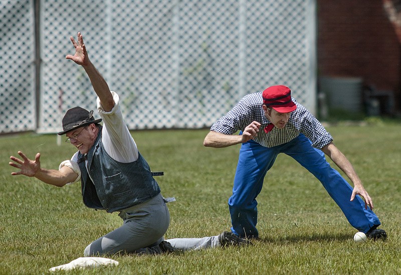 Stewart's Creek player Jeff Jennings, left, scrambles onto the bag as Lightfoot fielder Heath Farris fields the ball during a previous vintage base ball game in Fort Oglethorpe, Ga. Vintage base ball is played using Civil War-era rules. Players wear period attire and use only equipment that would have been available at that time.