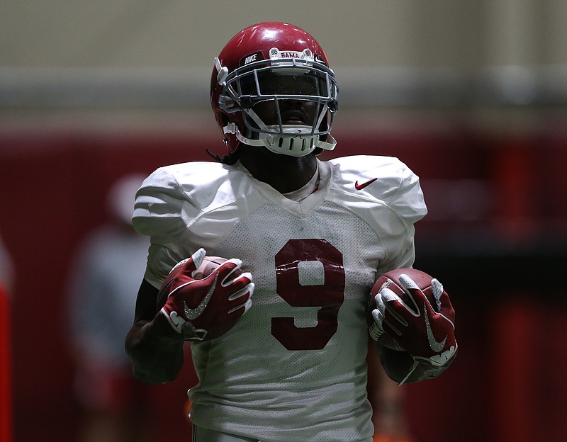 Alabama junior tailback Bo Scarbrough goes through a drill during Tuesday's indoor practice in Tuscaloosa.
