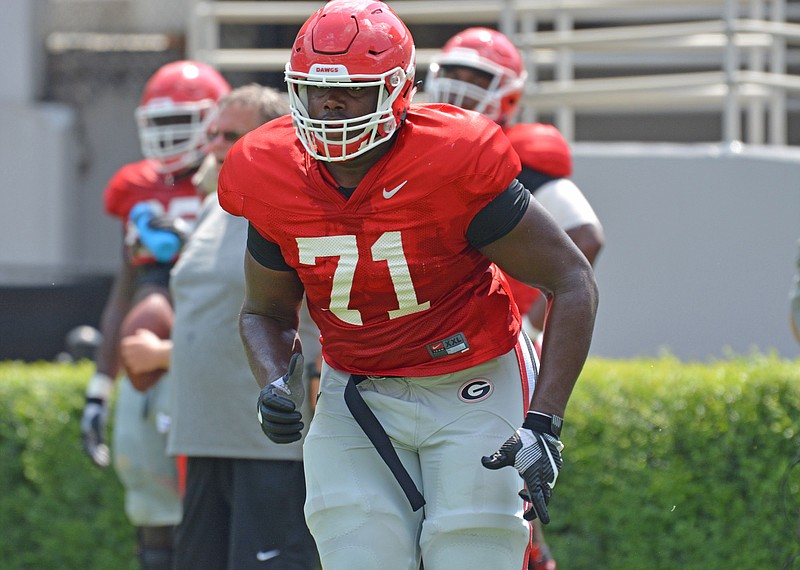 Freshman Andrew Thomas is getting looks at several positions on the offensive line with Isaiah Wynn out temporarily.