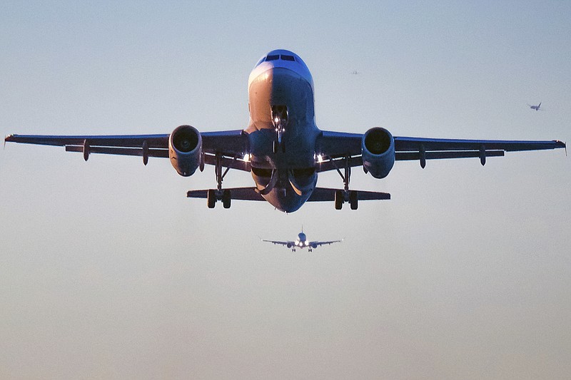 
              FILE - In this Wednesday, Nov. 23, 2016, file photo, passenger jets stack up over Reagan National Airport, in Washington. Following widespread outrage over a passenger who was violently dragged off an overbooked plane, U.S. airlines are bumping customers at the lowest rate in at least two decades. The Transportation Department said Tuesday, Aug. 8, 2017, that just one in every 19,000 passengers was kicked off an overbooked flight in the first six months of this year. (AP Photo/J. David Ake, File)
            