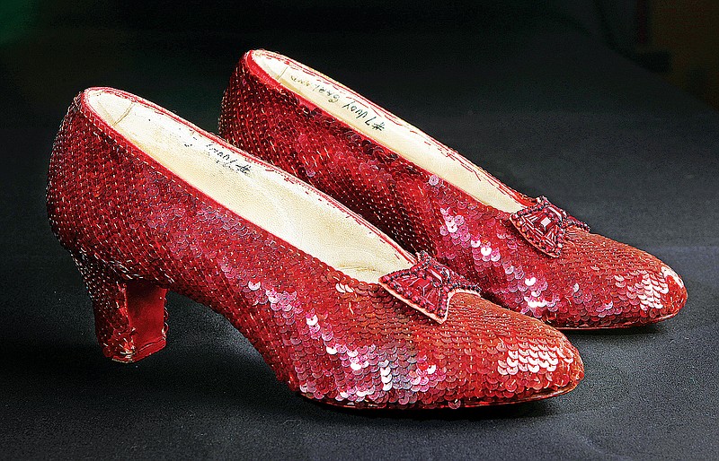 No, the Catoosa Community Players' production of "The Wizard of Oz" opening Friday will not feature the actual sequin-covered ruby slippers worn by Judy Garland in 1939, as pictured above, but will include flying and other one-of-a-kind special effects. (REED SAXON/THE ASSOCIATED PRESS/FILE)