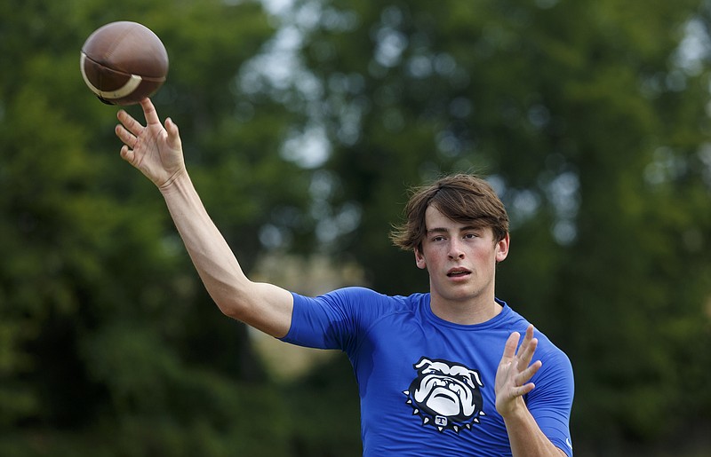 Trion quarterback Jarrett Gill passes the ball at a 7-on-7 passing camp on Wednesday, July 13, 2016, in Calhoun, Tenn.