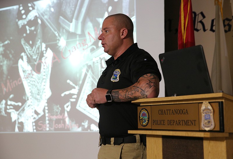 Chattanooga Police Department Sgt. Josh May gives a "Mindset of a Gang Member" presentation Wednesday, Aug. 9, 2017, at the Public Service Center in Chattanooga, Tenn. May explained the Violence Reduction Initiative, Focused Deterrence and the challenges of addressing gang-related crime in Chattanooga.