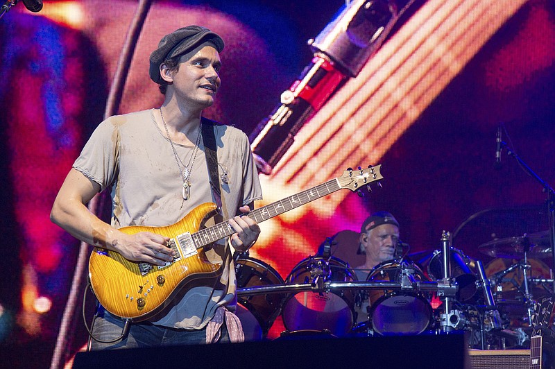 
              FILE - In this June 12, 2016, file photo, John Mayer of Dead & Company performs at Bonnaroo Music and Arts Festival in Manchester, Tenn. Mayer paid tribute to Glen Campbell on Tuesday, Aug. 8, 2017, during his concert in Nashville, Tenn., hours after the country music legend died in the city. (Photo by Amy Harris/Invision/AP, File)
            