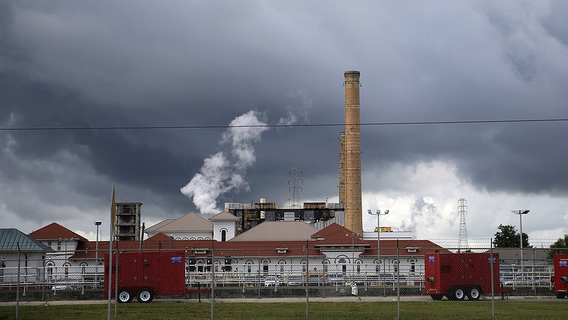 Rain clouds gather over the New Orleans Sewerage & Water Board facility, where turbines that power pumps have failed, in New Orleans, Thursday, Aug. 10, 2017. Gov. John Bel Edwards declared a state of emergency in New Orleans on Thursday as the city's malfunctioning water-pumping system left some neighborhoods at greater risk of foul-weather flooding. The city scrambled to repair fire-damaged equipment at a power plant and shore up its drainage system, less than a week after a flash flood from torrential rain overwhelmed the city's pumping system and inundated many neighborhoods. (AP Photo/Gerald Herbert) (AP Photo/Gerald Herbert)