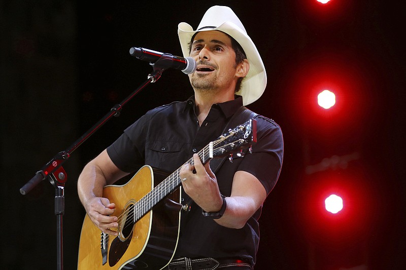 
              FILE - In this June 2, 2017 file photo, Country music recording artist Brad Paisley performs at the graduation for Barrington High School, at Willow Creek Community Church in South Barrington, Ill. Paisley says years of hosting the Country Music Awards and writing songs with humorous lyrics have - hopefully - prepared him to host his first comedy special, the “Brad Paisley Comedy Rodeo,” which will premiere on Netflix on Tuesday, Aug. 15. (Steve Lundy /Daily Herald via AP, File)
            