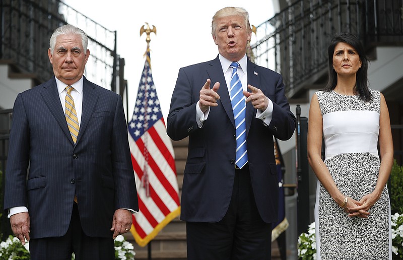 President Donald Trump gestures while speaking following his meeting with Secretary of State Rex Tillerson, left, and U.S. Ambassador to the United Nations Nikki Haley at Trump National Golf Club in Bedminster, N.J., Friday, Aug. 11, 2017. (AP Photo/Pablo Martinez Monsivais)