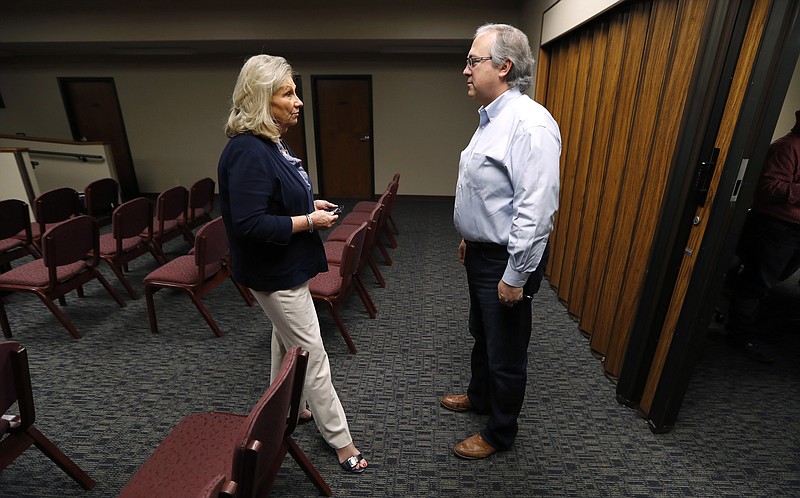 
              In this Wednesday, Aug. 2, 2017 photo, U.S. Rep. David Young, R-Iowa, speaks with Glenwood Area Chamber of Commerce Executive Director Linda Washburn, left, during a stop at the Glenwood City Hall,  in Glenwood, Iowa. Conservatives in Young's district are angry with the GOP's failure to repeal and replace Obamacare. Independents don't like the partisan approach. And now Democrats are making an issue of Young's vote for a health care bill that President Donald Trump called "mean." (AP Photo/Charlie Neibergall)
            