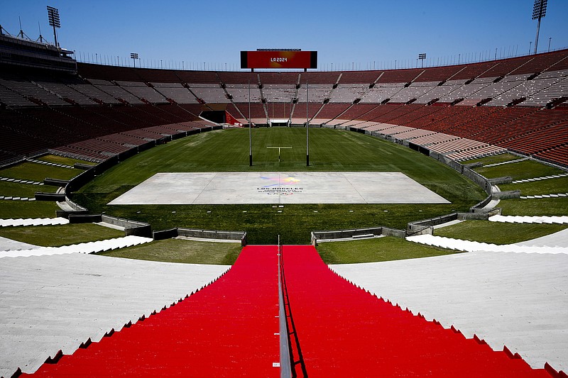 
              FILE - In this May 11, 2017, file photo, Los Angeles Memorial Coliseum, the venue proposed for Olympic opening and closing ceremonies and track and field events. stands in Los Angeles. The Los Angeles City Council is expected Friday, Aug. 11, 2017 to endorse a proposal to host the 2028 Olympics, following an announcement of a deal last month to leave 2024 to Paris. (AP Photo/Jae C. Hong, File)
            