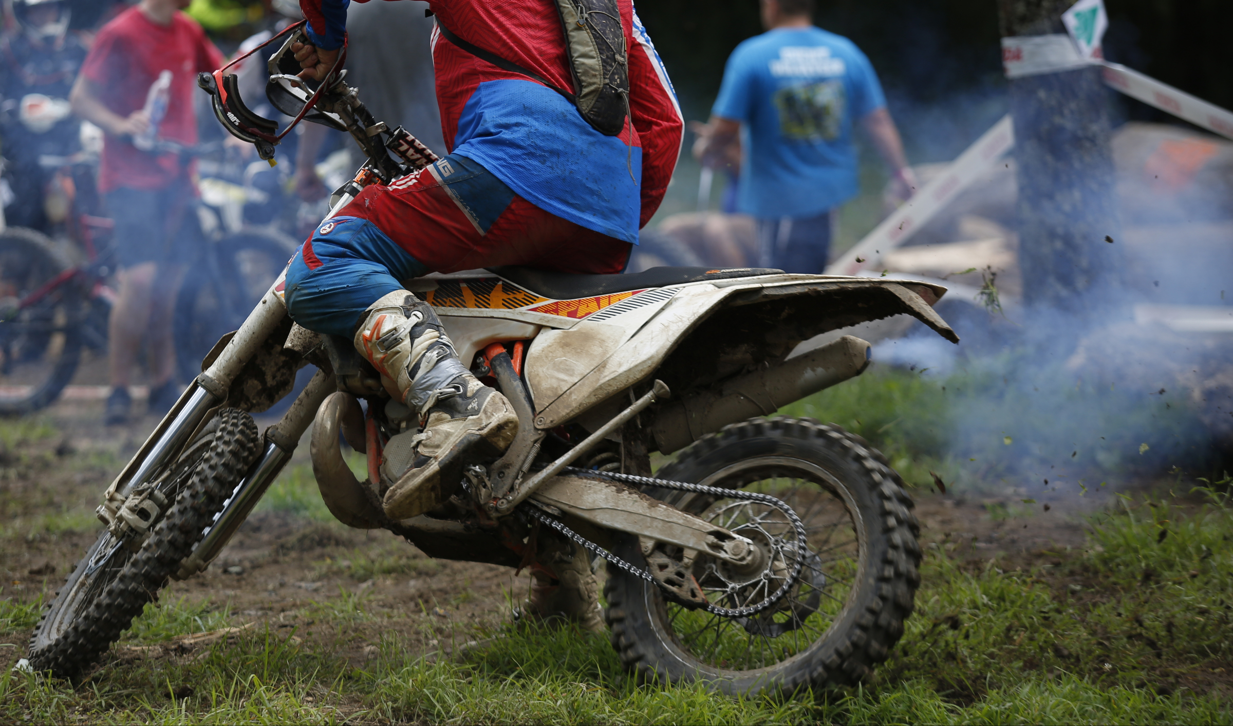 A competitor sprays mud as he makes a turn before competing in the Kenda AMA Tennessee Knockout Extreme Enduro road race amateur qualifier at Trials Training Center on Saturday, Aug. 12, 2017, in Sequatchie, Tenn. The top 30 qualifiers in Saturdays races will compete alongside professionals on Sunday.