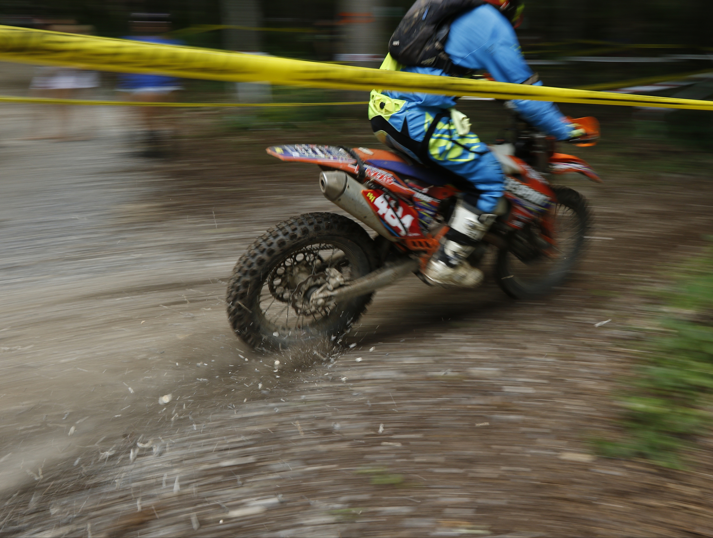 A competitor's bike sprays gravel as they compete in the Kenda AMA Tennessee Knockout Extreme Enduro road race amateur qualifier at Trials Training Center on Saturday, Aug. 12, 2017, in Sequatchie, Tenn. The top 30 qualifiers in Saturdays races will compete alongside professionals on Sunday.