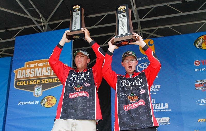 Bryan College anglers Jake Lee, left, and Jacob Foutz hold up their trophies after winning the 2017 Carhartt Bassmaster College Series national championship in Minnesota.