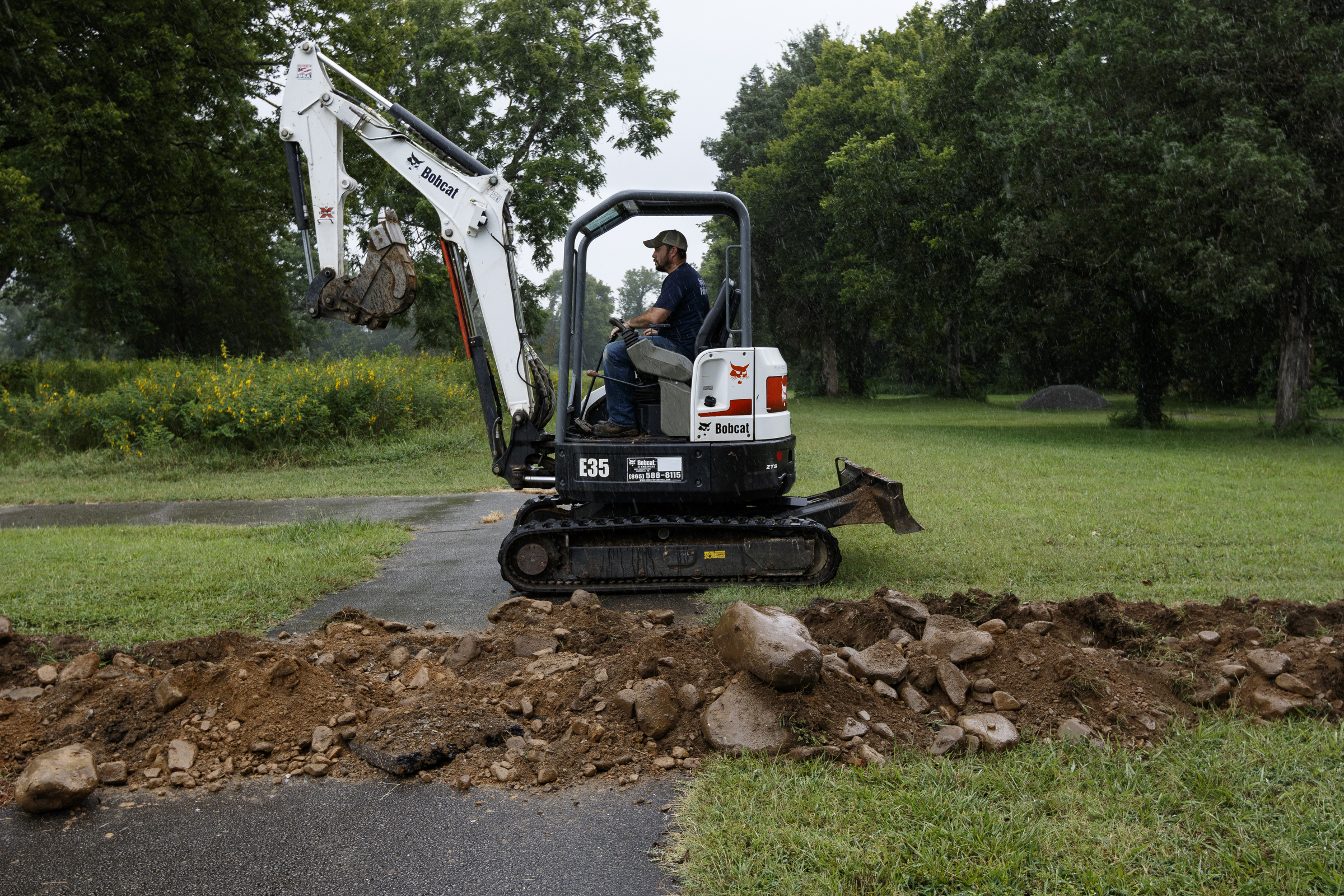 Kenyon Kilby with Spring City Public Works operates an excavator while installing additional power outlets in the Spring City Nature Park on Friday, Aug. 11, 2017, in Spring City, Tenn. On August 21, thousands are expected to flock to the small Rhea County town, which is home to about 2000 residents, to view the solar eclipse.