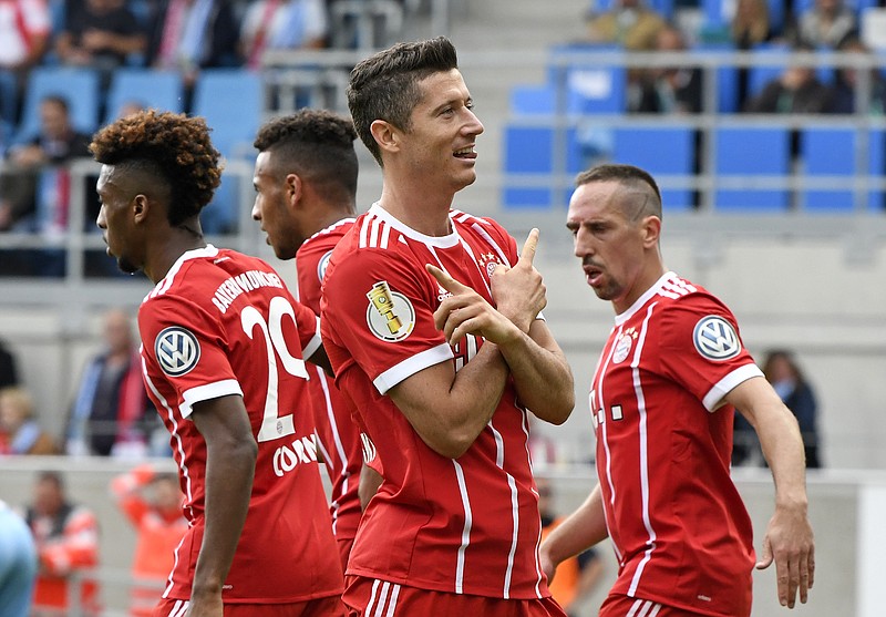 
              Bayern's Robert Lewandowski celebrates after scoring his second goal during the German soccer cup match between Chemnitzer FC and and FC Bayern Munich in Chemnitz, eastern Germany, Saturday, Aug. 12, 2017. (AP Photo/Jens Meyer)
            