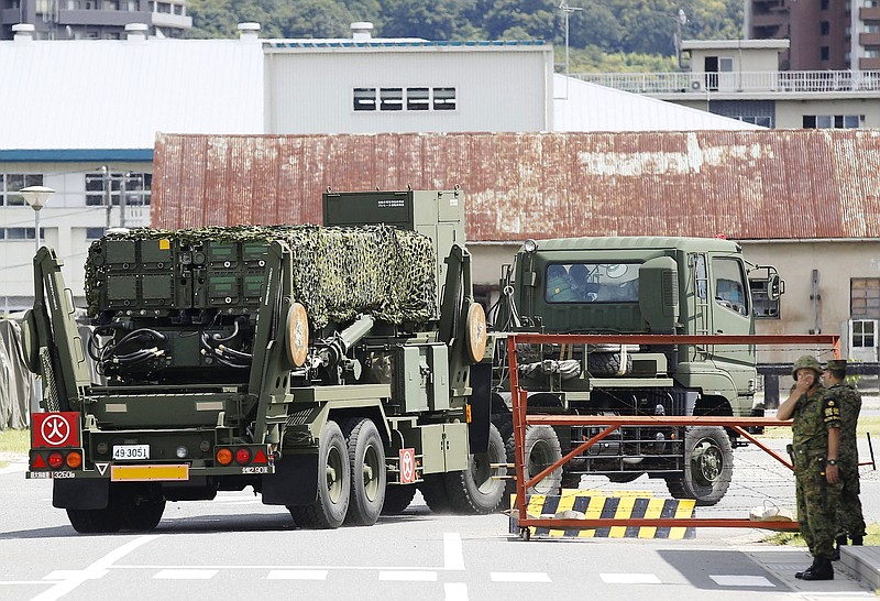 
              A PAC-3 interceptor unit arrives at a garrison of the Japan Ground Self-Defense Force in Kaita, Hiroshima prefecture, southwestern Japan, Saturday, Aug. 12, 2017. Japan started deploying land-based Patriot interceptors after North Korea threatened to send ballistic missiles flying over western Japan and landing near Guam. The Defense Ministry said Friday the PAC-3 surface-to-air interceptors are being deployed at four locations - Hiroshima, Kochi, Shimane and Ehime. (Yosuke Mizuno/Kyodo News via AP)
            