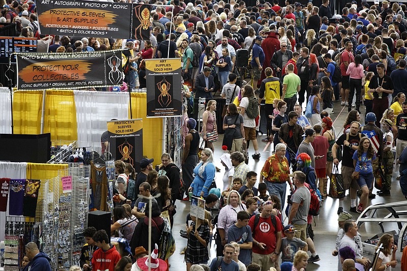 
              Fans crowd the display floor at Boston Comic Con, Friday, Aug. 11, 2017, in Boston. The convention is being held at the Boston Convention & Exhibition Center through Sunday. (AP Photo/Michael Dwyer)
            