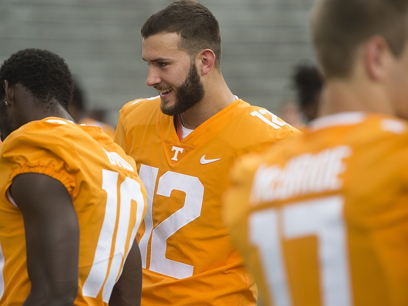 Quinten Dormady, center, is competing with Jarrett Guarantano for Tennessee's starting quarterback job.