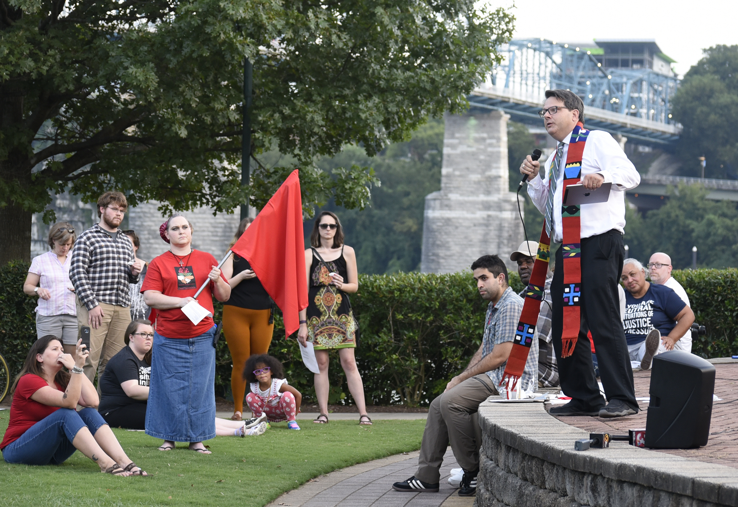 Pastor Brian Merritt, of Renaissance Presbyterian Church, addresses the people gathered in response to the violence in Charlottesville, Virginia. The Chattanooga Democratic Socialists hosted a candlelight vigil for Heather Heyer and Charlottesville at Coolidge Park on August 13, 2017.