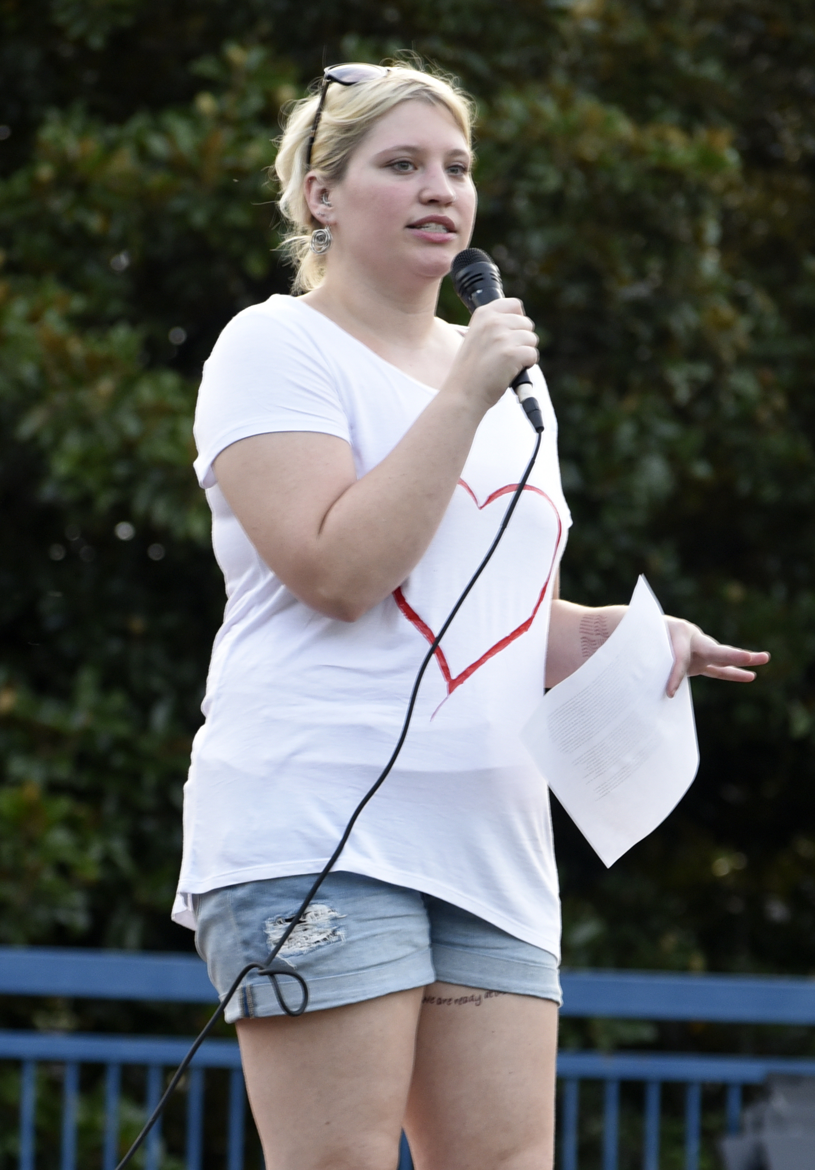Lacey Sanderlin of the Chattanooga Democratic Socialists addresses the crowd. The Chattanooga Democratic Socialists hosted a candlelight vigil for Heather Heyer and Charlottesville at Coolidge Park on August 13, 2017.
