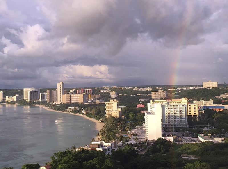 
              A rainbow appears over Tumon Bay, Guam Sunday, Aug. 13, 2017. Residents of the U.S. Pacific island territory of Guam face a missile threat from North Korea. (AP Photo/Tassanee Vejpongsa)
            