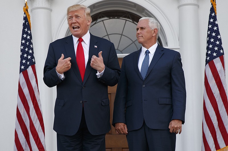 
              In this Aug. 10, 2017, photo, President Donald Trump, accompanied by Vice President Mike Pence, speaks to reporters before a security briefing at Trump National Golf Club in Bedminster, N.J. Pence departs Sunday for Latin America, a trip that comes on the heels of yet another provocative statement fromTrump that Pence is sure to have to answer for: this time Trump’s sudden declaration that he would not rule out a “military option” in Venezuela, where president Nicolas Maduro has been consolidating power, plunging the country into chaos. (AP Photo/Evan Vucci)
            