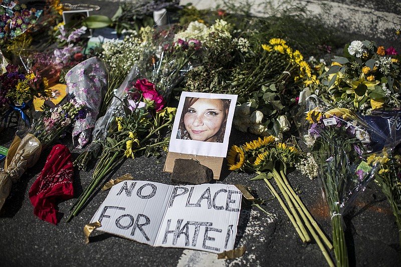 A memorial for Heather Heyer has been set up at the scene where she was killed when a man drove into a crowd during a protest against a rally of white nationalists in Charlottesville, Va., on Saturday.