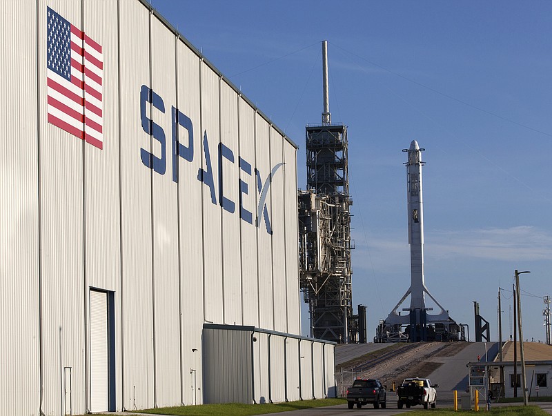 
              In this photo provided by NASA, a SpaceX Falcon 9 rocket and Dragon spacecraft await liftoff from NASA Kennedy Space Center’s Launch Complex 39A in Cape Canaveral, Fla., on Monday, Aug. 14, 2017. SpaceX is about to launch a few tons of research to the International Space Station — plus ice cream. (Kim Shiflett/NASA via AP)
            