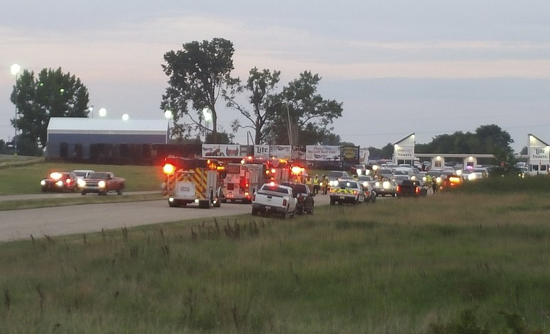 
              Emergency response vehicles gather at Great Lakes Dragaway on Sunday, Aug. 13, 2017, near Union Grove, Wis. Three men were shot and killed during an auto racing event at the facility, a Wisconsin sheriff said. Kenosha County Sheriff David Beth said authorities responded around 7 p.m. after receiving reports about shots being fired. The three men were shot by another man at point-blank range near a food vendor, Beth said at a news conference Sunday night. No suspects were arrested and no one else was injured. (Terry Flores/Kenosha News via AP)
            