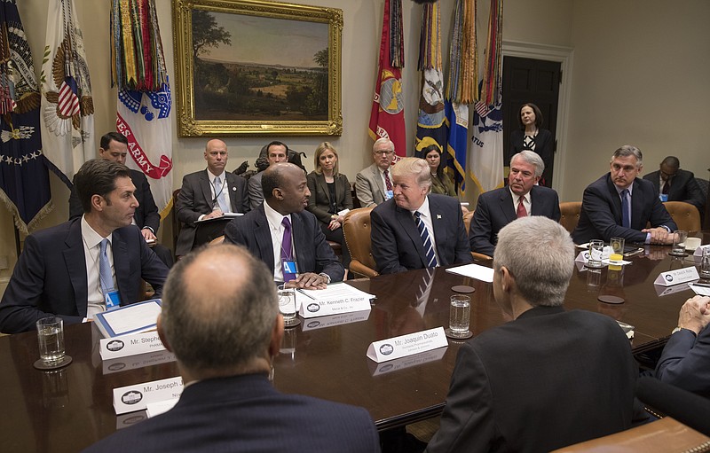 FILE — Kenneth Frazier, second from left, the chief executive of Merck, and President Donald Trump during a meeting with pharmaceutical company executives at the White House in Washington in January. Frazier and three other CEOs have shown the courage to resign as a presidential advisers. (Stephen Crowley/The New York Times)