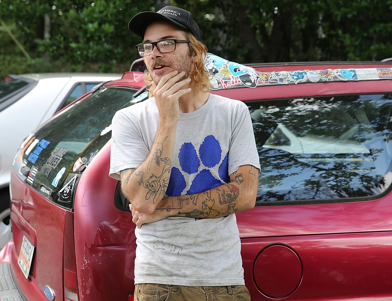 Terrance Hightower, 28, talks about his experience being fired from Mojo Burrito in St. Elmo Monday after a co-worker called him a "Nazi" on social media after Hightower attended the Unite the Right rally in Charlottesville, Va. During an interview Tuesday, Aug. 15, 2017, at his Rossville, Ga., home. Hightower says he not a Nazi just a right-wing Donald Trump supporter who went to Charlottesville to oppose the removal of Confederate Gen. Robert E. Lee's statue from a park there.