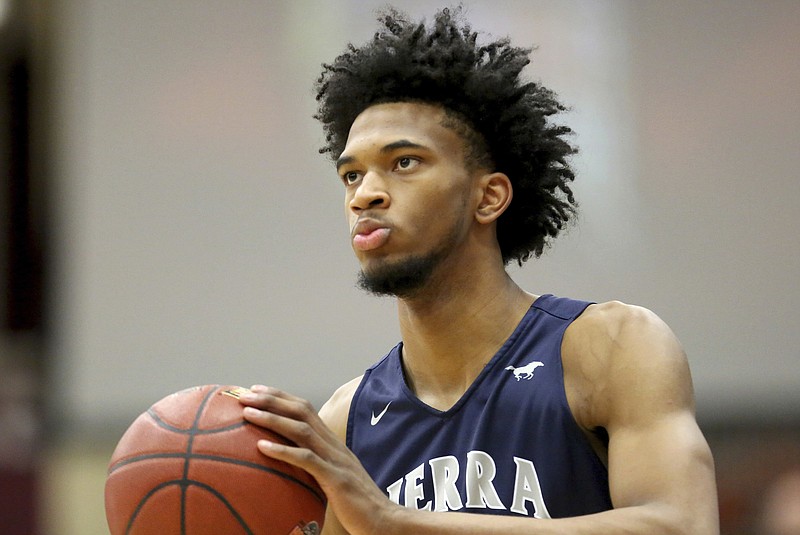 
              In this Monday, Jan. 16, 2017, file photo, Sierra Canyon's Marvin Bagley III #35 warms up against La Lumiere during a high school basketball game at the Hoophall Classic in Springfield, MA. Bagley III, a top high school prospect, has committed to Duke and reclassified for the 2017-18, immediately making the Blue Devils a top national-title contender this season. (AP Photo/Gregory Payan, File )
            