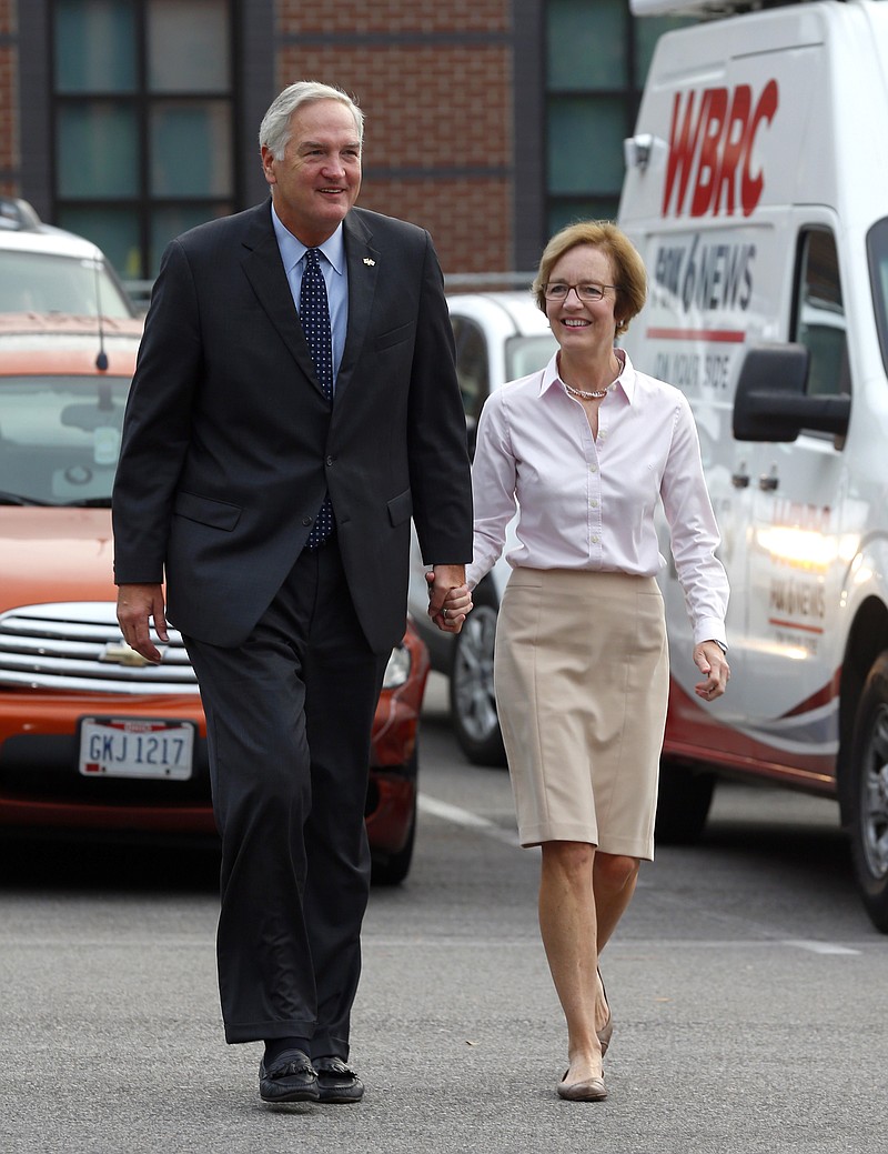 
              Senator Luther Strange walks in with his wife, Melissa, to cast their votes, Tuesday, Aug. 15, 2017, in Homewood, Ala.  Alabama voters are casting ballots Tuesday to select party nominees in the closely watched Senate race for the seat that belonged to Attorney General Jeff Sessions. (AP Photo/Butch Dill)
            