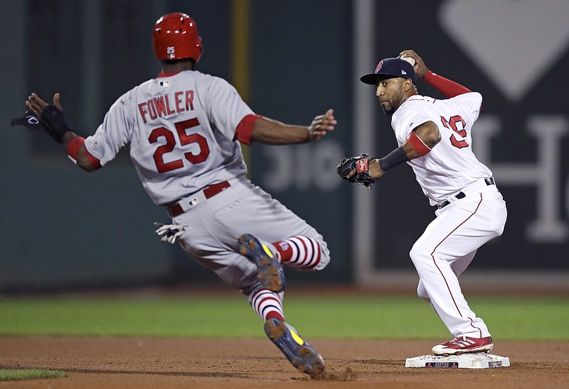 
              Boston Red Sox second baseman Eduardo Nunez, right, forces out St. Louis Cardinals' Dexter Fowler for the second out of a triple play during the fourth inning of a baseball game in Boston, Tuesday, Aug. 15, 2017. (AP Photo/Charles Krupa)
            