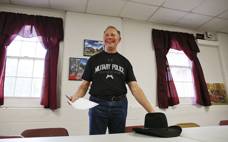 Former Alabama Chief Justice and U.S. Senate candidate Roy Moore smiles after he votes at the Gallant Volunteer Fire Department, Tuesday, Aug. 15, 2017, in Gallant, Ala. Alabama's Republicans and Democrats were casting ballots Tuesday to select party nominees in the closely watched race for the Senate seat vacated by Attorney General Jeff Sessions. The GOP race is testing the reach of both Trump and Senate Majority Leader Mitch McConnell. (AP Photo/Brynn Anderson)