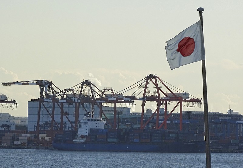 
              In this Jan. 25, 2017 photo, a Japanese flag is hoisted near the pier of a container terminal in Tokyo. Japan's exports and imports rose at a fast clip in July, reflecting a recovery in demand in China, Southeast Asia and the U.S., according to data released Thursday, Aug. 17, 2017. (AP Photo/Eugene Hoshiko)
            