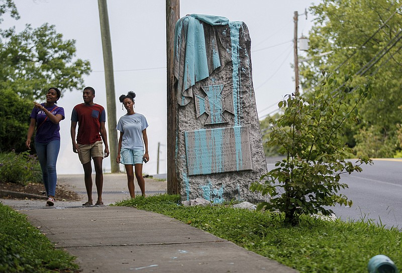 
              A paint-covered monument to Confederate soldiers who died in an 1863 battle stands along a road in Knoxville, Tenn., on Wednesday, Aug. 16, 2017. (AP Photo/Erik Schelzig)
            